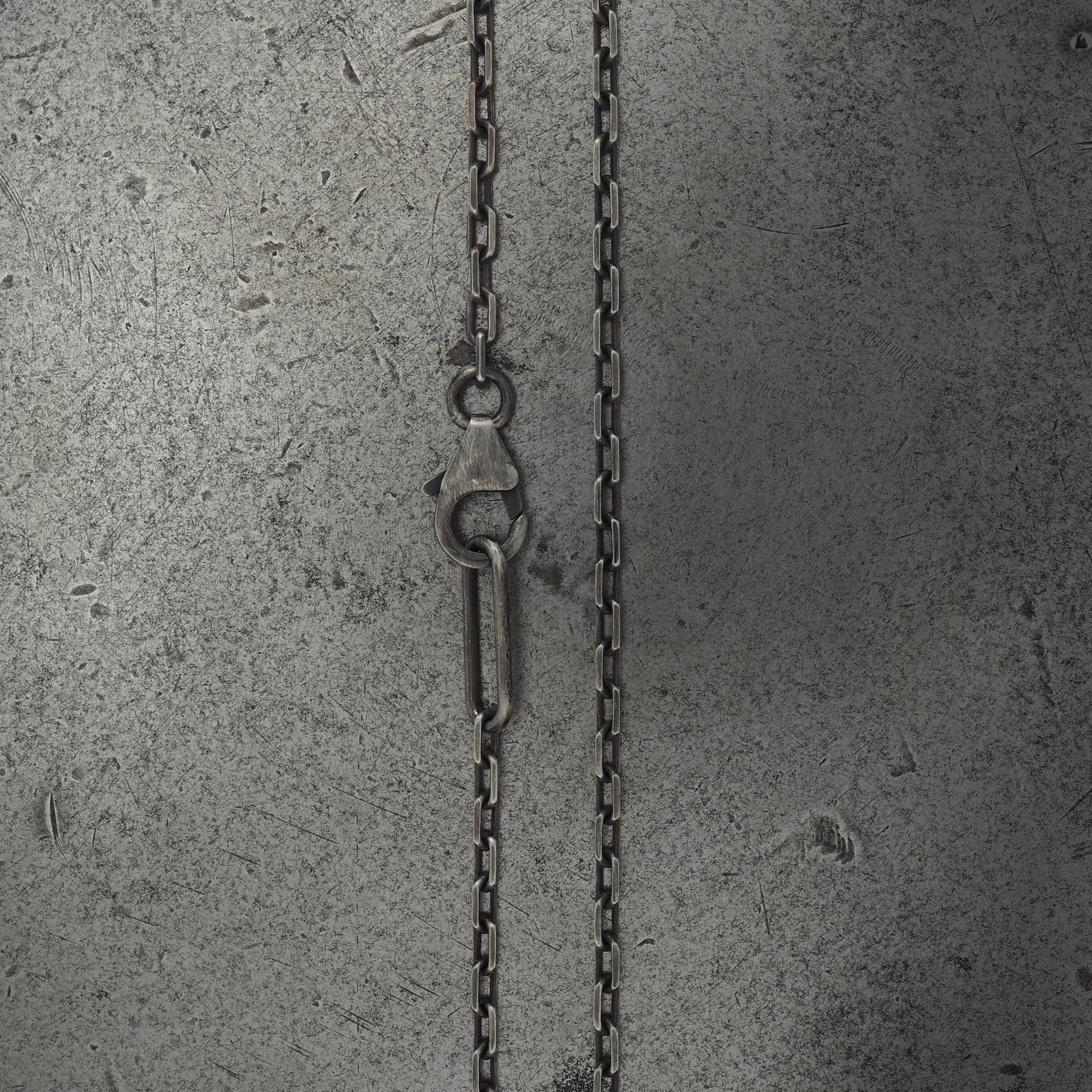Crater skull pendant silver