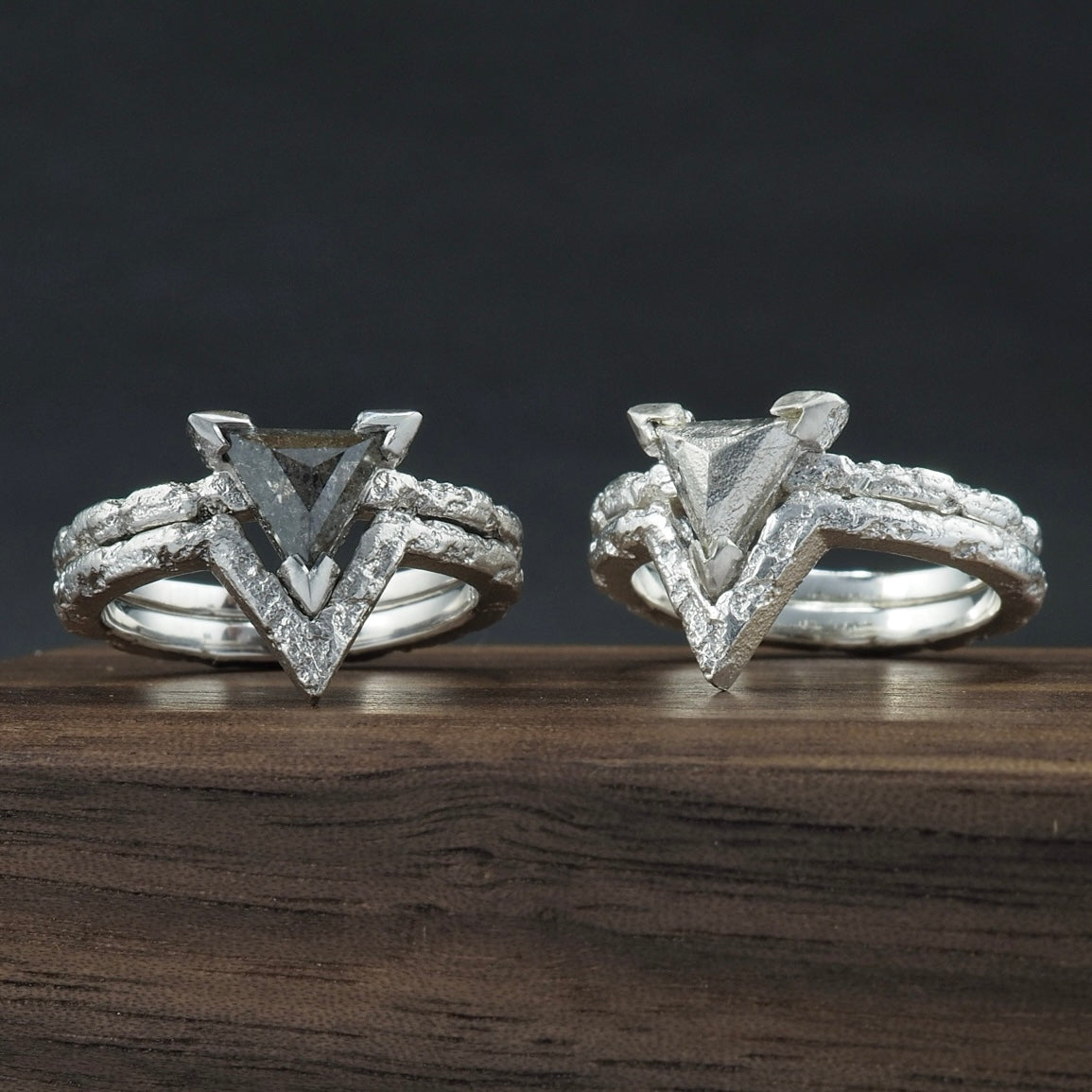 Crater engagement and wedding ring set, random texture that evoke thoughts of ruins, set with a triangle salt and pepper diamond